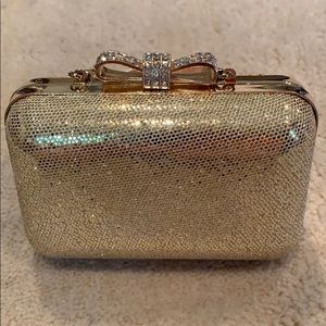 Gold sparkle evening bag with diamond ribbon
